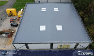 Aerial photo of the completed flat roof at Cameron Court, Warrington, featuring skylights and a uniform single-ply membrane installation.