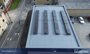 Aerial view of a refurbished flat roof with Protan single ply membrane and solar panels at the Central Hub Youth Centre in Huddersfield.